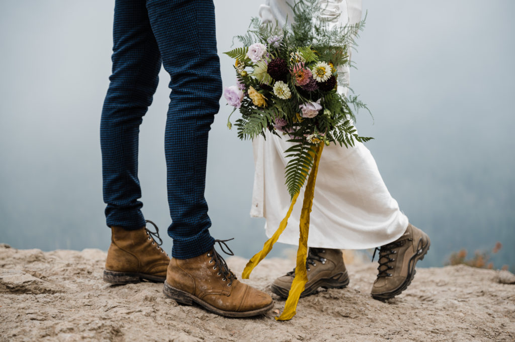 Couple wearing hiking boots during their adventure elopement in Washington State
