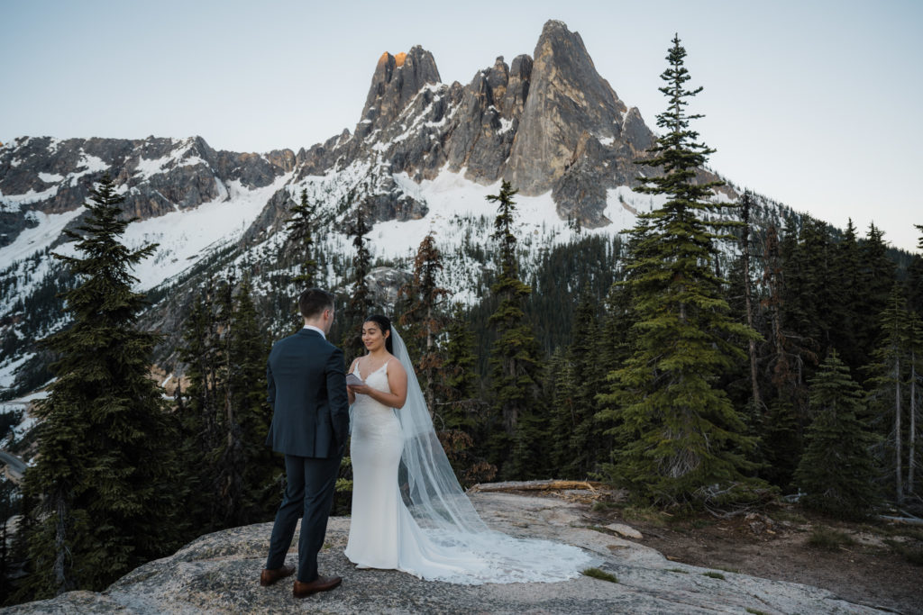 A couple exchanging vows during their North Cascades National Park elopement.