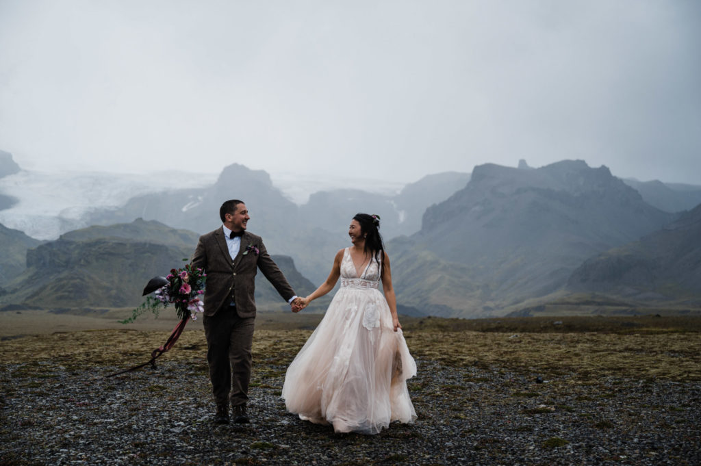 Couple eloping in Iceland in front of a glacier