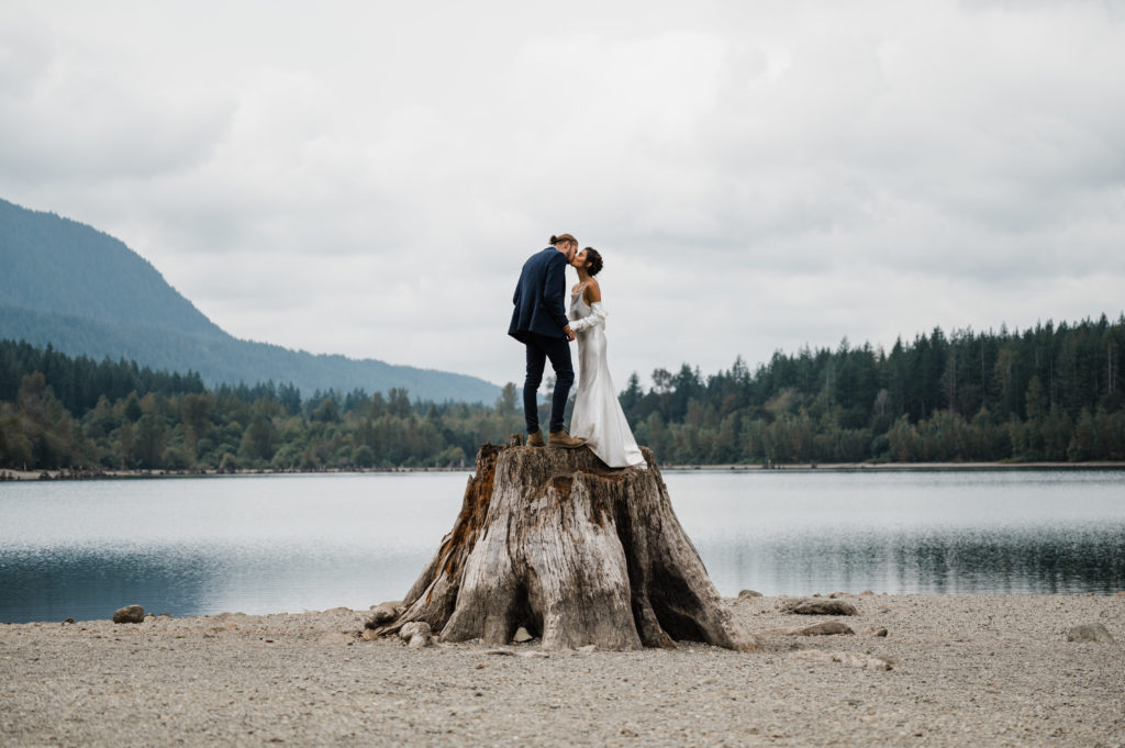 Couple in their wedding attire at Rattlesnake Lake after eloping in Washington State