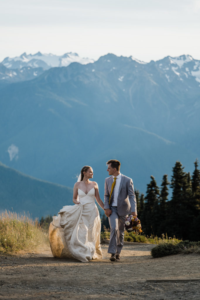 Couple in their wedding attire hiking at Hurricane Ridge in Olympic National Park
