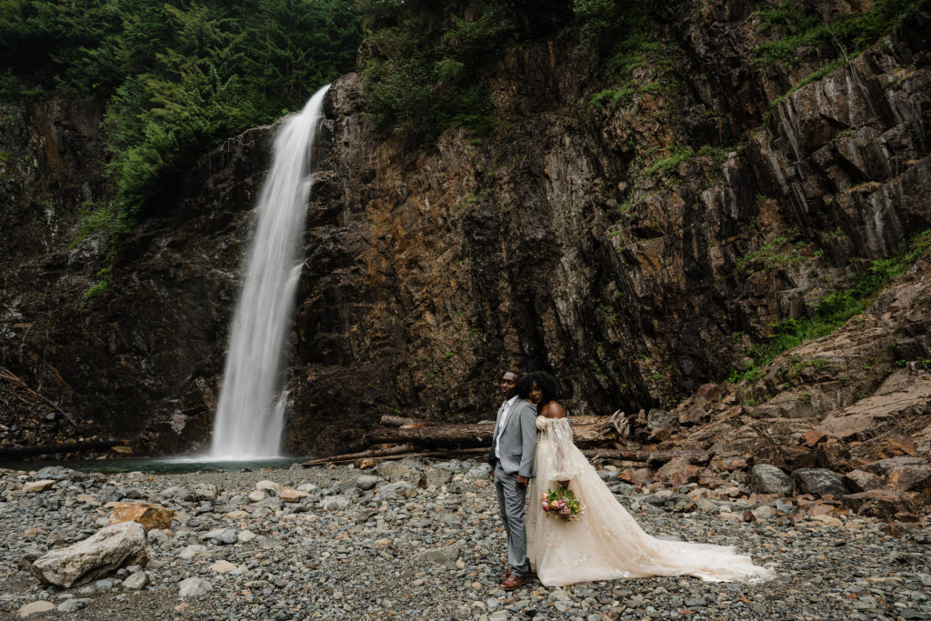 Couple eloping next to Franklin Falls in Washington State