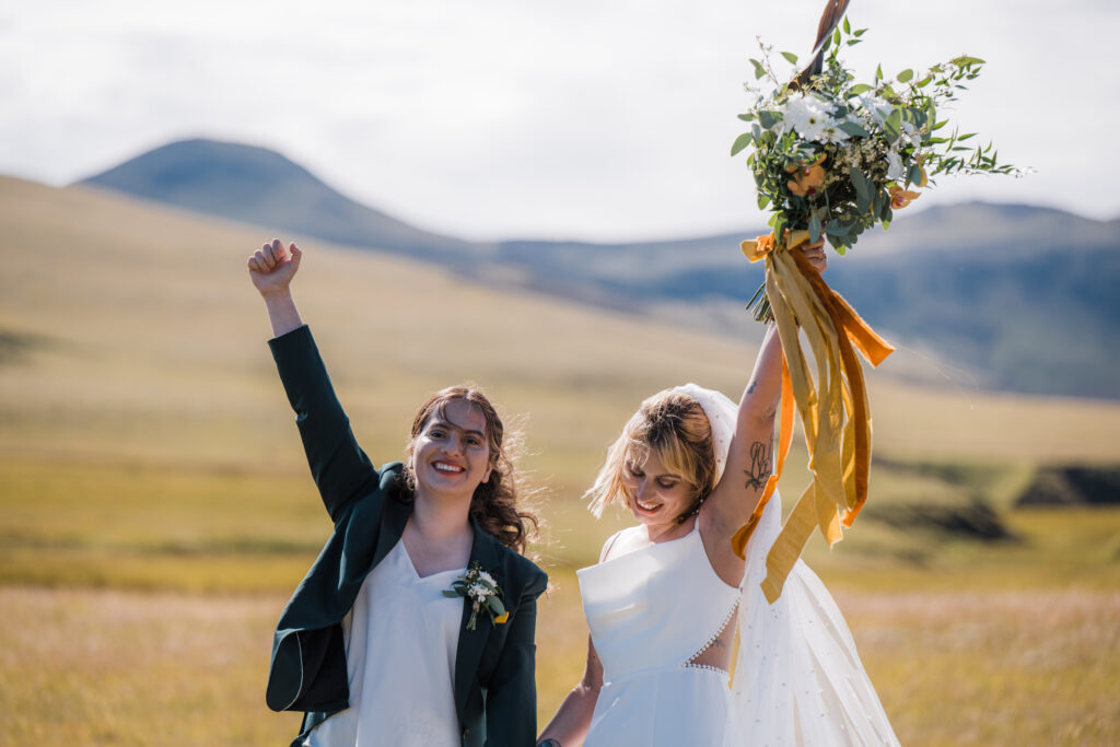 LGBTQ couple cheering after getting married in Iceland