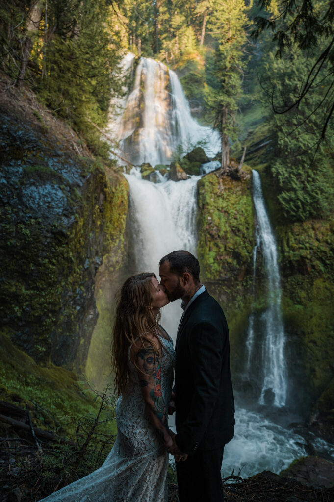 couple getting married by a waterfall in Washington 