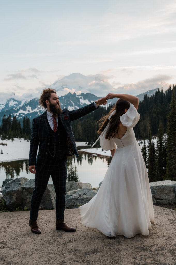 couple having their first dance after their elopement at mount rainier national park