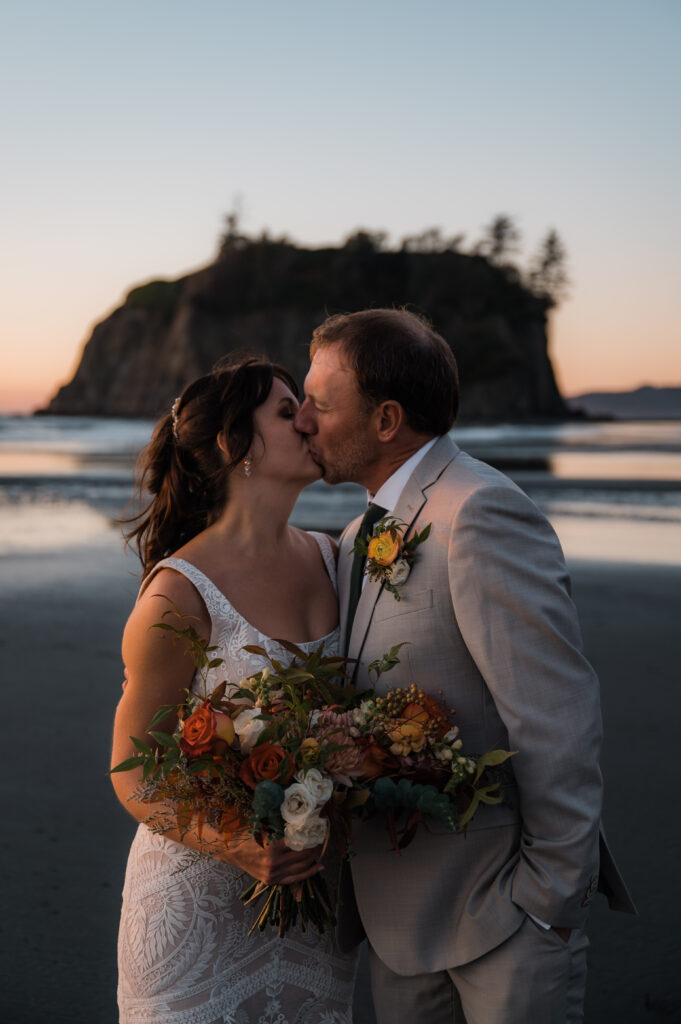 bride and groom kissing during their sunset portraits at Ruby Beach where they eloped