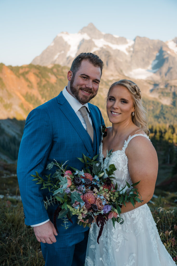 Couple smiling at the camera after getting married at Artist Point in Washington State