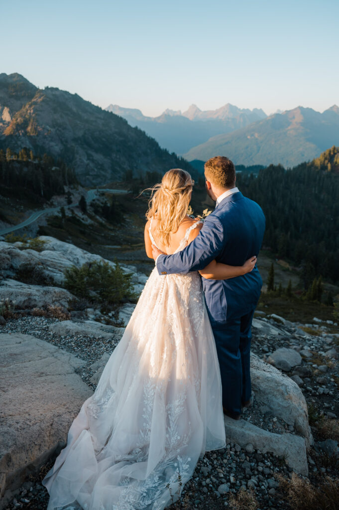 Couple standing together admiring the views of the mountains in the North Cascades