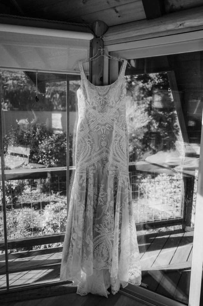 brides dress during photos at their Lake Sutherland airbnb