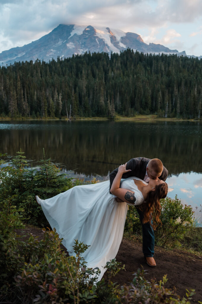 Couple kissing after getting married at Reflection Lake in Mount Rainier National Park 