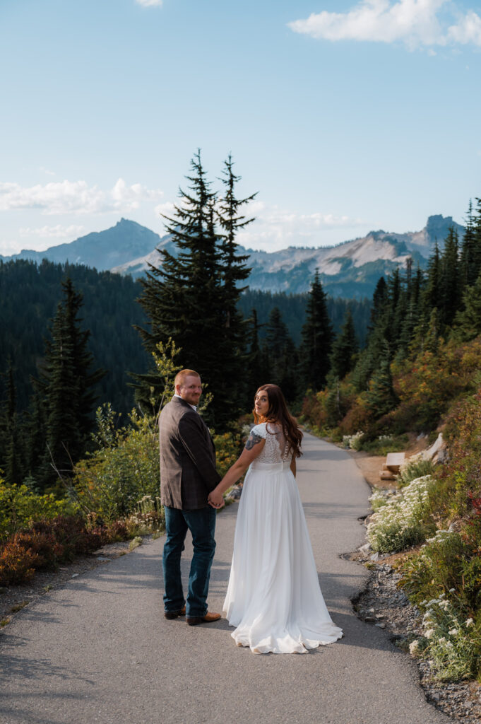 Newly married couple hiking in Mount Rainier National Park 