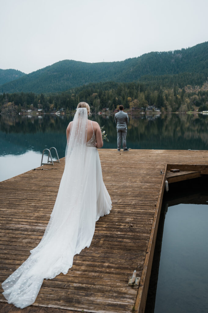 first look on the dock at Lake Sutherland in Olympic National Park during an elopement