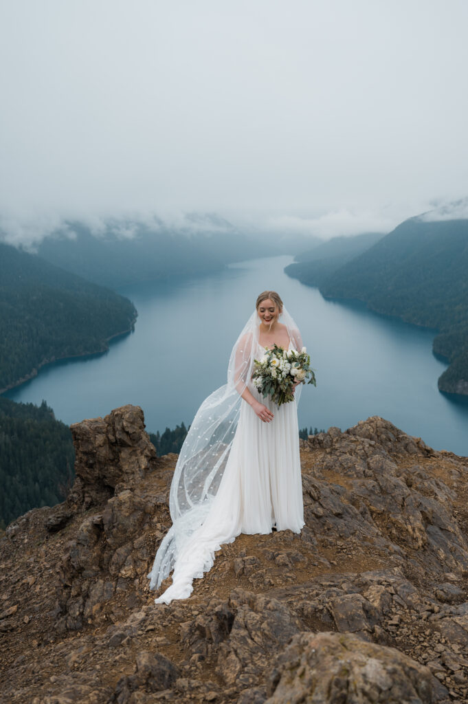 bridal portraits with Lake Crescent and mountains in the background in Olympic National Park