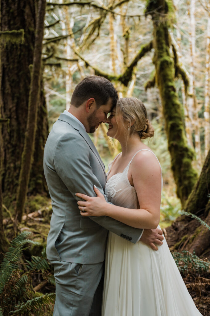 intimate couples photos with mossy trees in Olympic National Park