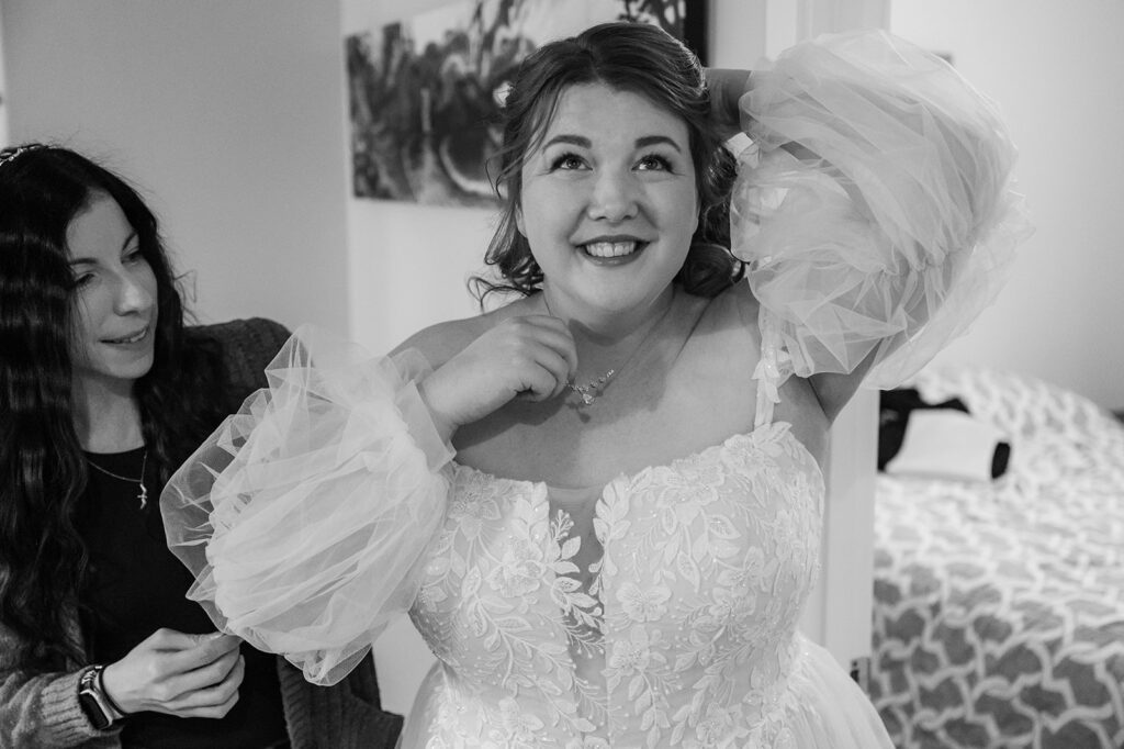 Bride getting ready before a redwood forest elopement