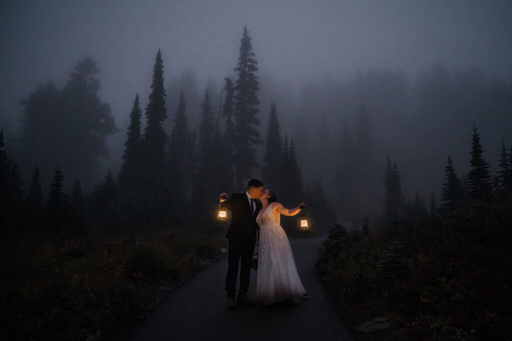 Bride and groom hike back down Skyline Trail with lanterns