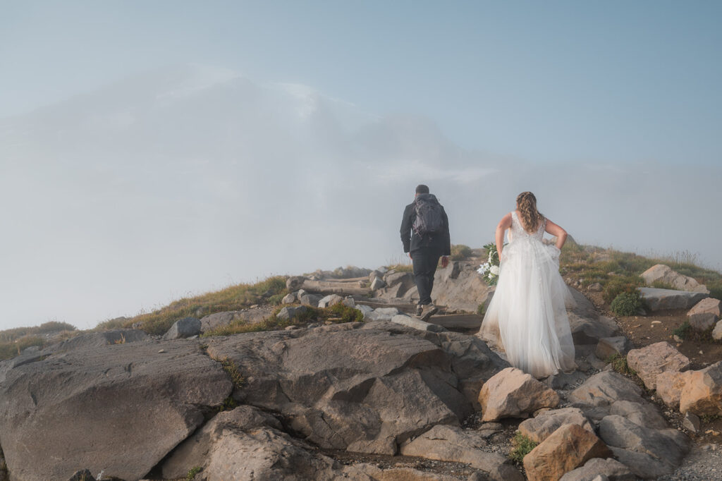 Bride and groom hiking up Skyline Trail at Mt. Rainier