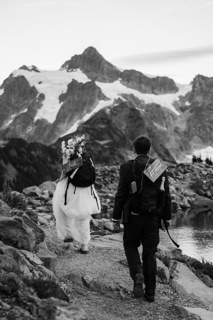 Bride and groom hike back down after their intimate North Cascades wedding ceremony