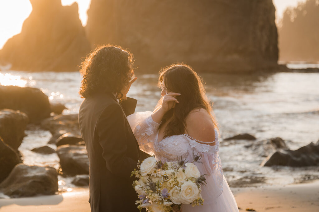 Bride and groom have an emotional elopement ceremony on Rialto Beach