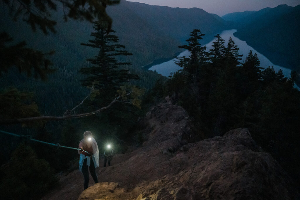 Bride and groom hike up Mount Storm King before sunrise