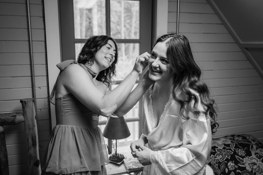 Bride gets ready in the cabin before her Mt. Hood elopement ceremony 