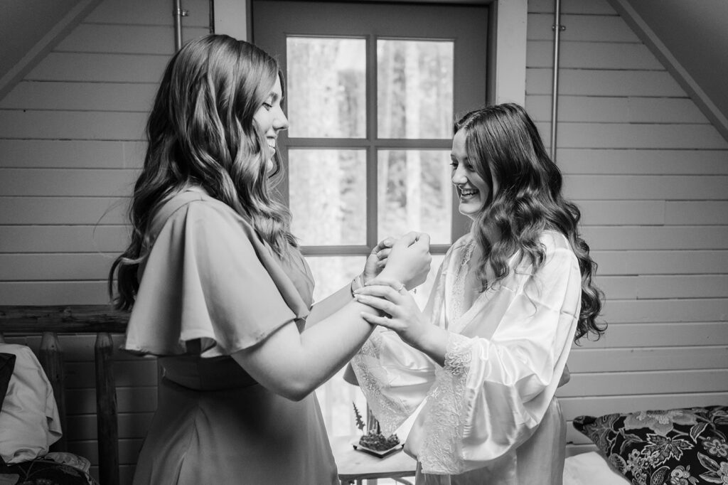 Bride gets ready in the cabin before her Mt. Hood elopement ceremony 