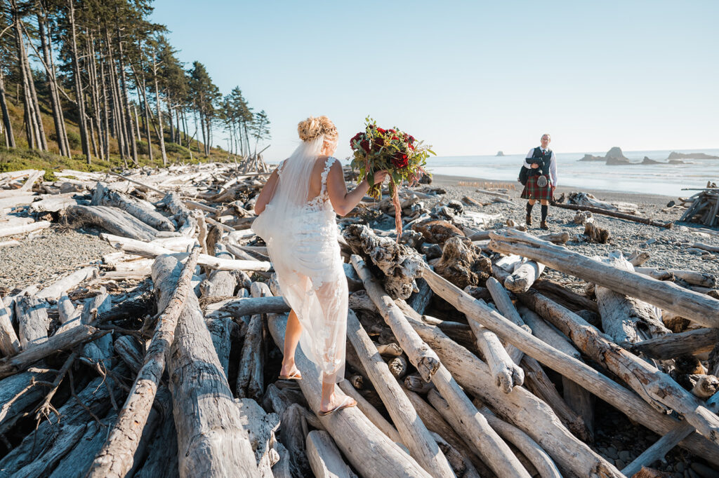 Bride and groom walk out to Ruby Beach