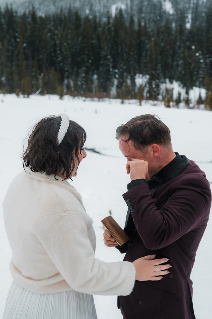 couple exchanging vows during their winter elopement at Mount Hood Oregon