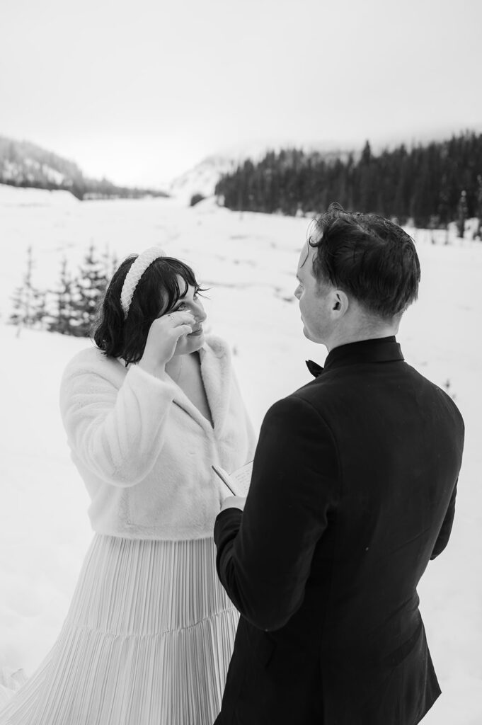 couple exchanging vows during their elopement ceremony at Mount Hood Oregon in the winter
