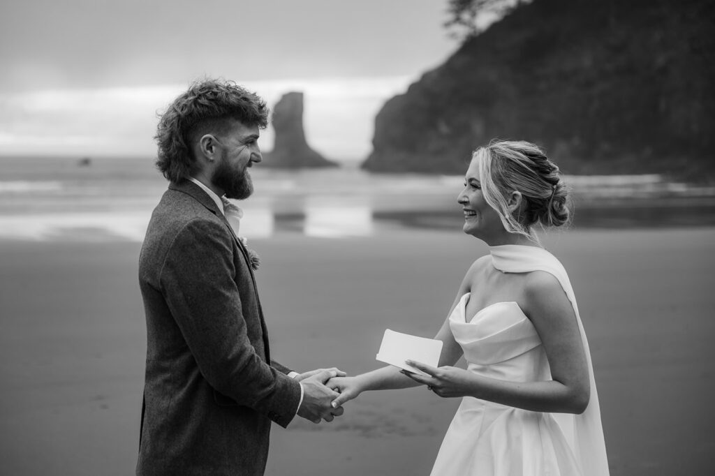 bride and groom reading vows at Second Beach on a rainy PNW elopement day
