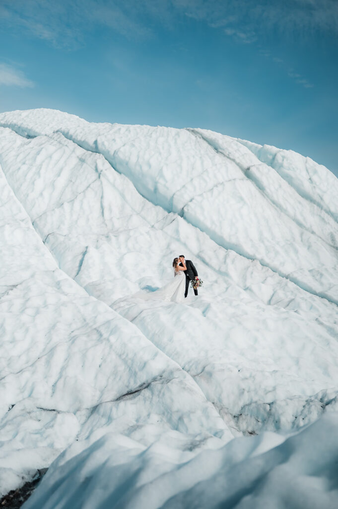 bride and groom on the matanuska glacier in alaska