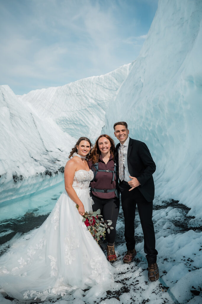 wandering peaks elopement photographer smiling with her eloping couple during their alaska glacier elopement 