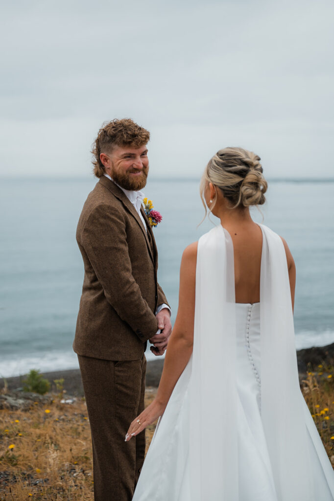 groom sees the bride for the first time during their moody PNW elopement day in Olympic National Park