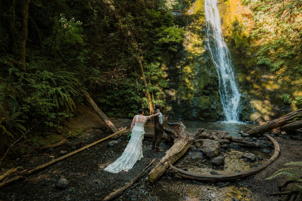 eloping couple having their first look at Madison falls 