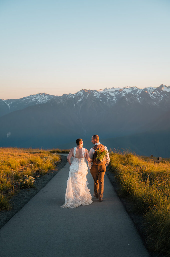 couple hiking at sunset on their hurricane ridge elopement day 