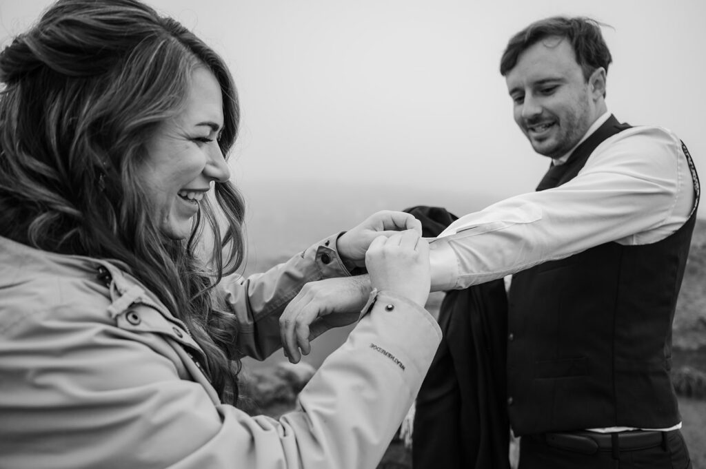 Mt. Rainier elopement photography of couple getting ready on mountain trail