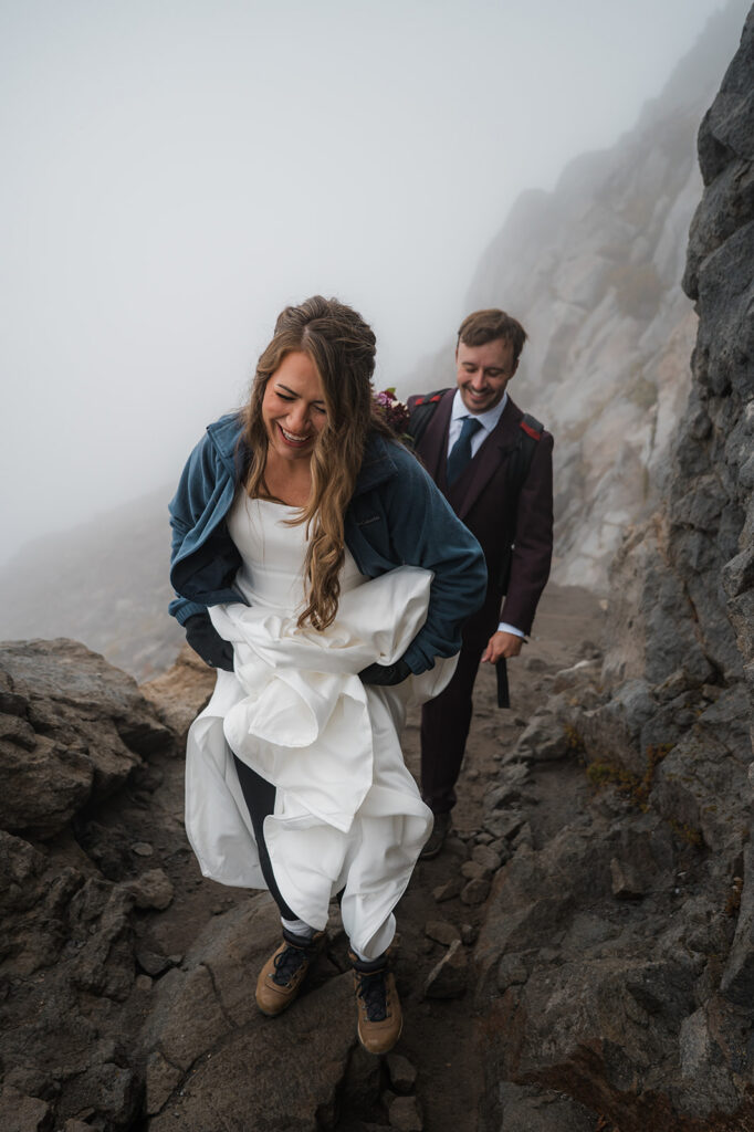 Couple hiking the Skyline Trail during a cloudy elopement at Mt. Rainier