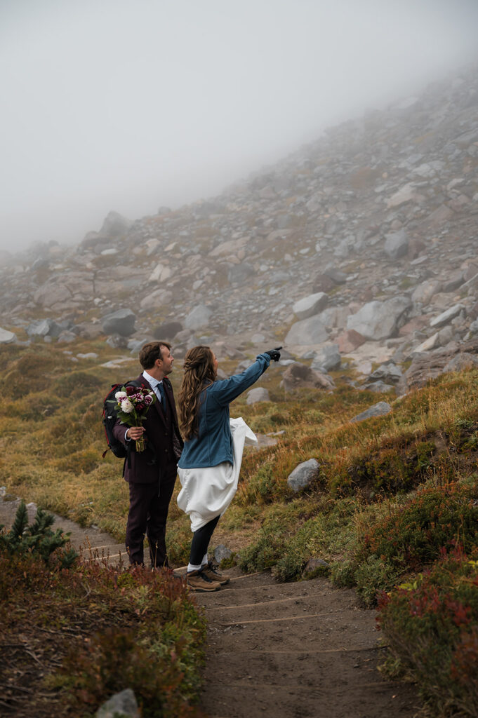 Bride and groom wrapped in layers during cold October elopement at Mt. Rainier
