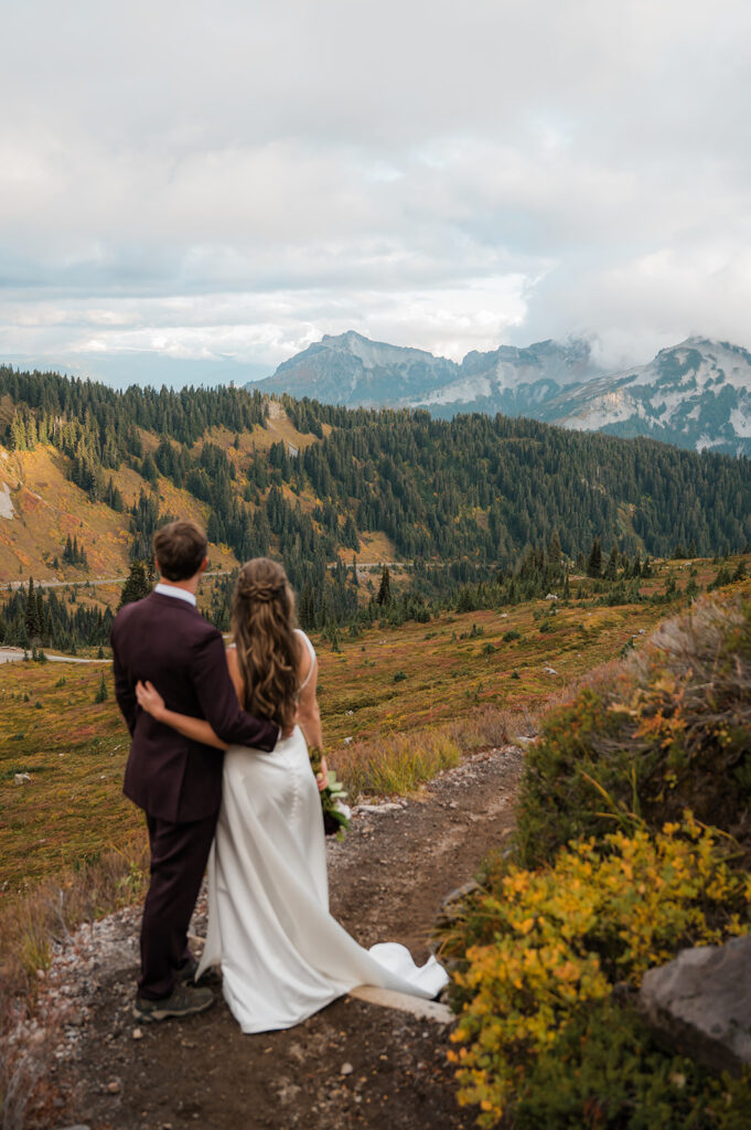 Couple walking along Skyline Trail with soft fall colors and low clouds