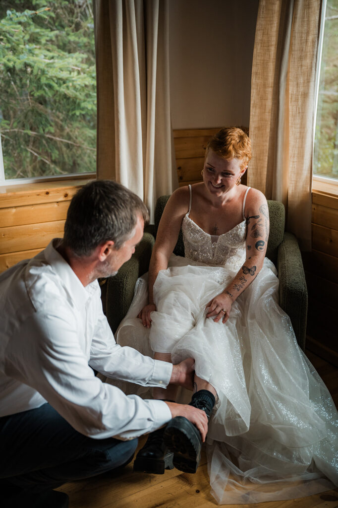 Seward Alaska elopement at Salted Roots Cabins with couple getting ready together in cabin