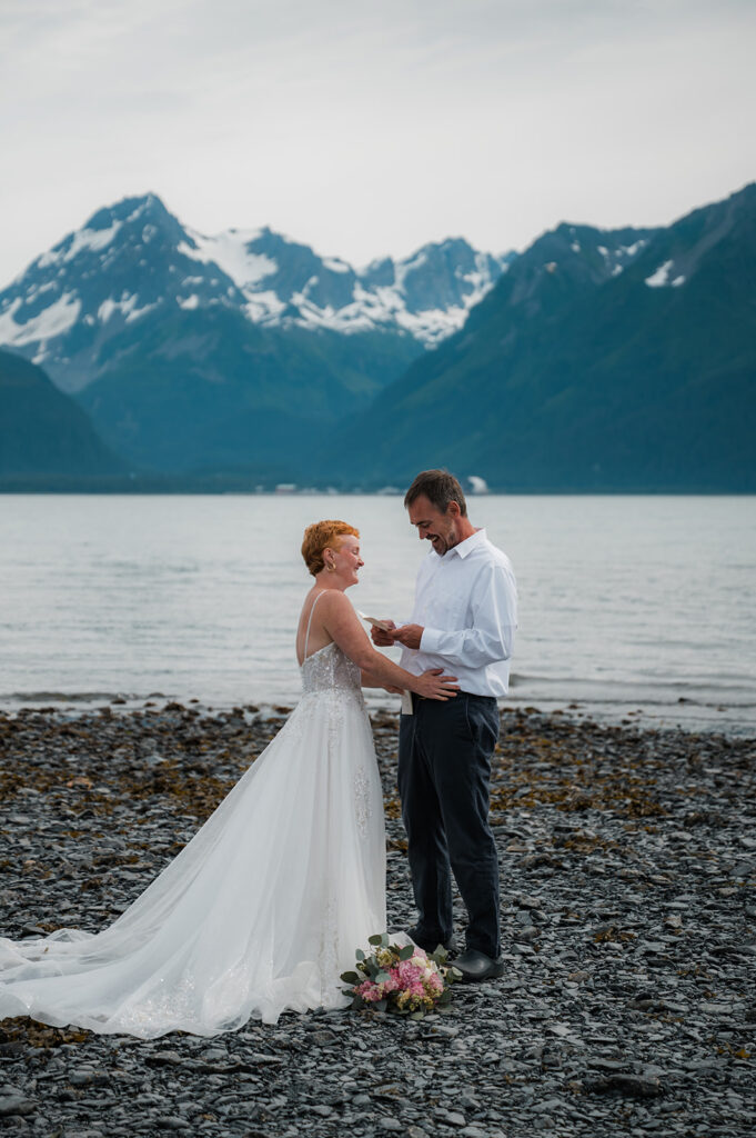 Emotional vow exchange during a coastal Seward Alaska elopement