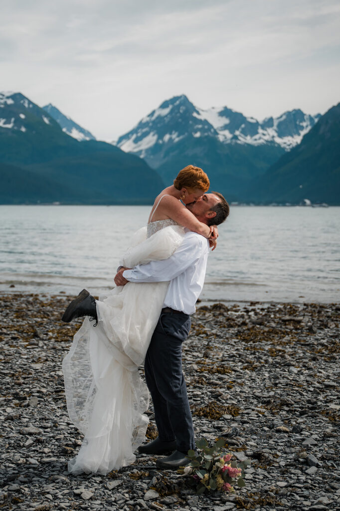 Seward Alaska elopement portraits with ocean and dramatic mountain backdrop
