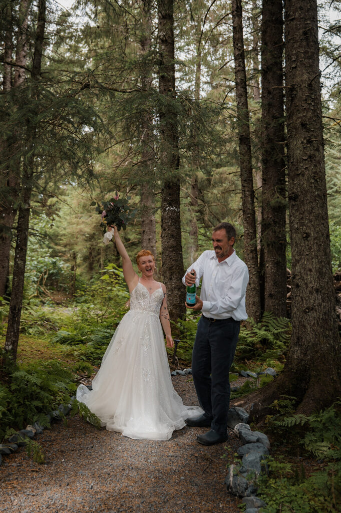 Couple popping sparkling water to celebrate their Alaska elopement day