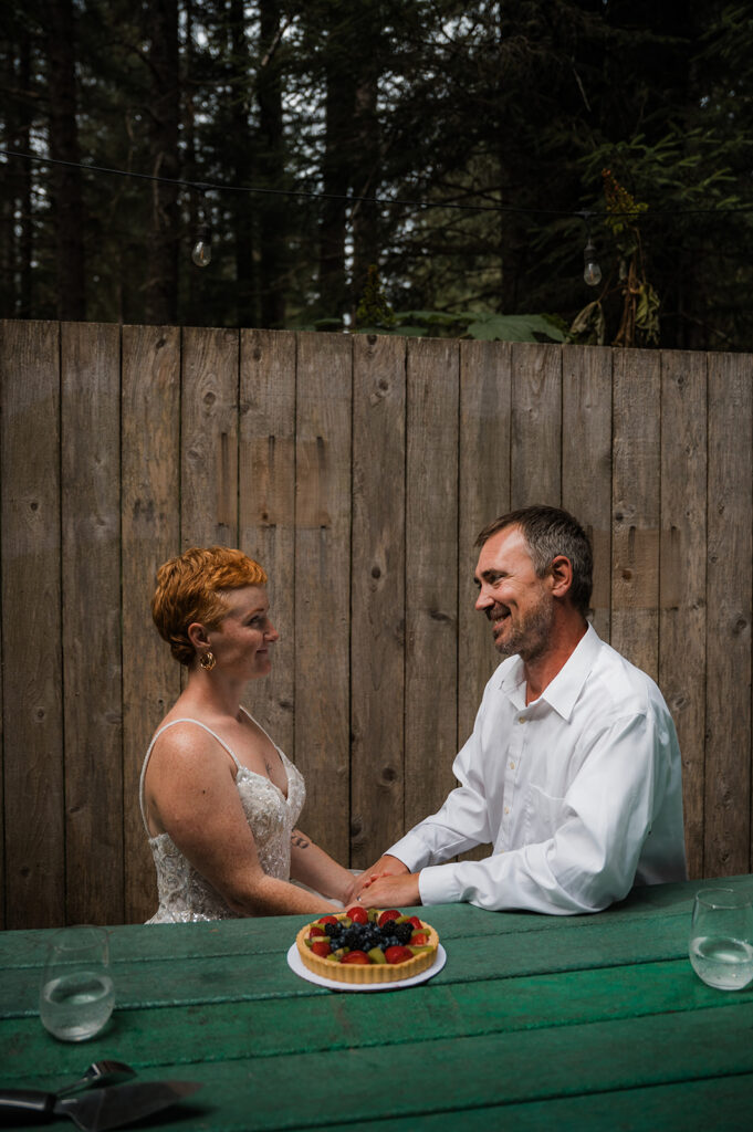 Intimate Alaska elopement celebration with fruit tart and sparkling water